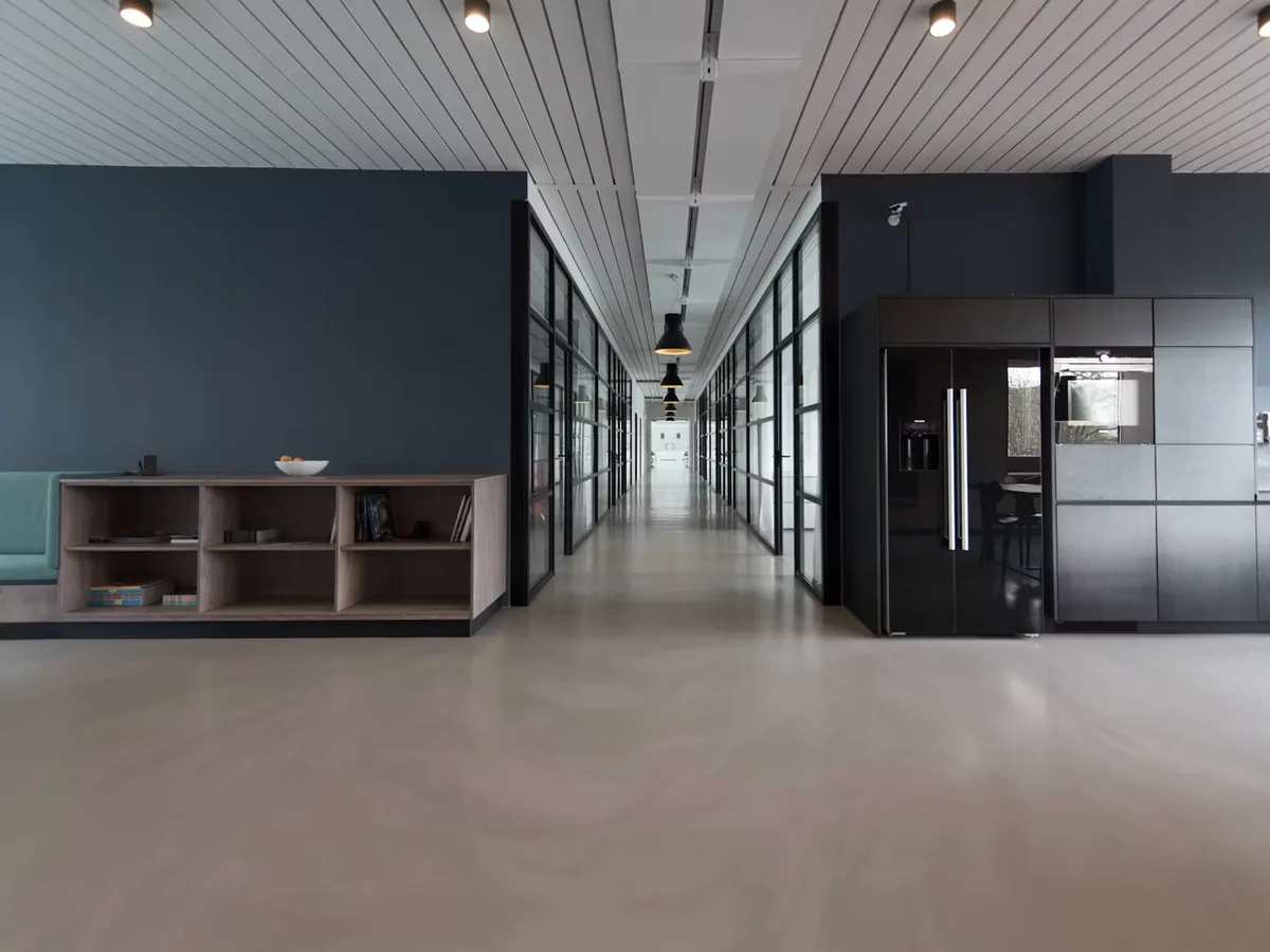 Modern commercial office interior with clean desks and ergonomic chairs